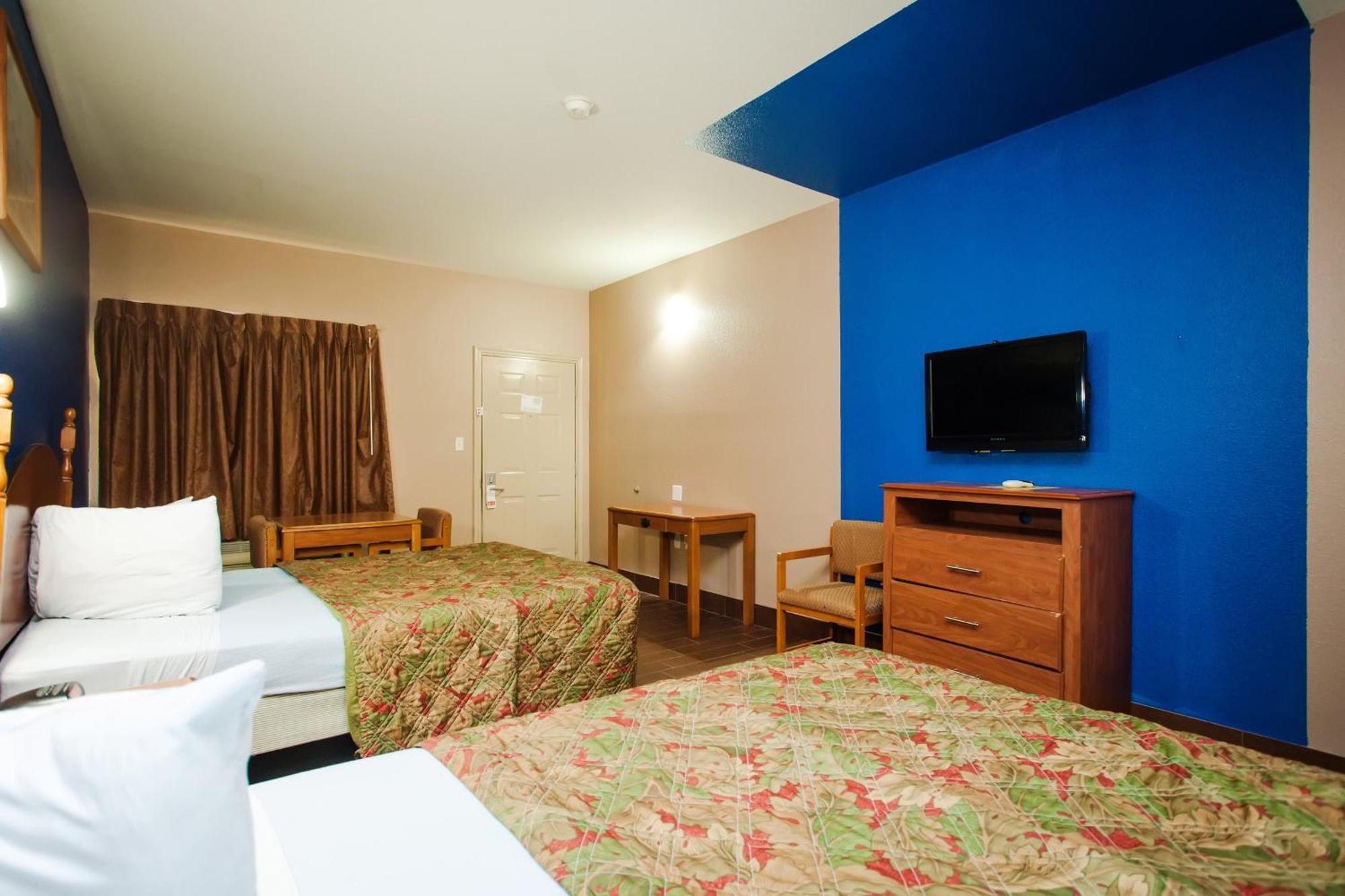Scottish Inn & Suites Hankamer Quarto foto