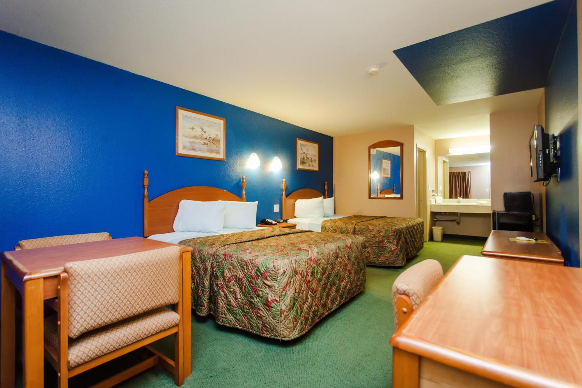 Scottish Inn & Suites Hankamer Quarto foto